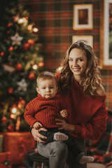 Wall Mural - Young Mum celebrates Christmas with her daughter