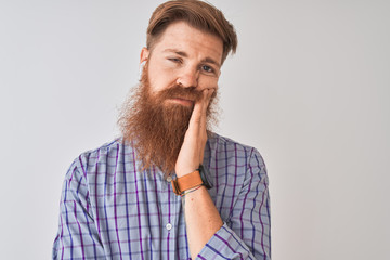 Poster - Redhead irish man listening to music using wireless earphones over isolated white background thinking looking tired and bored with depression problems with crossed arms.