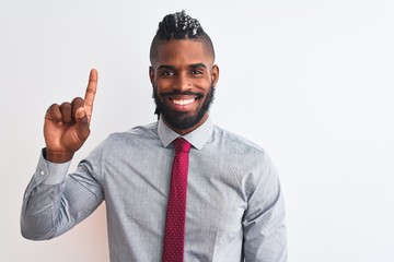 African american businessman with braids wearing tie standing over isolated white background showing and pointing up with finger number one while smiling confident and happy.