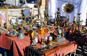 Selling antiques on the street market at the fair