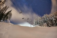 Ski Lift In The Alps At Night With Starry Sky Above
