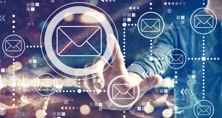 Email concept with a man on blurred city background