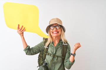 Sticker - Senior hiker woman wearing canteen holding speech bubble over isolated white background screaming proud and celebrating victory and success very excited, cheering emotion