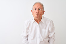 Senior Grey-haired Man Wearing Elegant Shirt Standing Over Isolated White Background Making Fish Face With Lips, Crazy And Comical Gesture. Funny Expression.