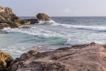 Wall Mural - Caribbean sea coast with rocks and hello breaking