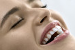 Closeup view at woman's mouth with perfect teeth