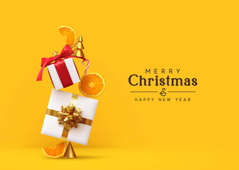 Merry Christmas and Happy New Year. Background with realistic festive gifts box, orange slices conical metal Christmas trees. Xmas present. Abstract balanced composition design concept