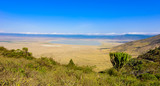Fototapeta Sawanna - Panorama of Ngorongoro crater National Park with the Lake Magadi. Safari Tours in Savannah of Africa. Beautiful landscape scenery in Tanzania, Africa