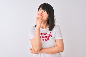 Wall Mural - Young beautiful Chinese woman wearing fanny t-shirt over isolated white background serious face thinking about question, very confused idea