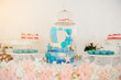 canvas print picture - close up photo a blue 3 tier birthday cake for 1 year boy in a candy bar