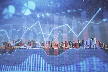 Forex graph on city view with skyscrapers background double exposure. Financial analysis concept.