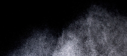 Wall Mural - Texture of a snowstorm isolated on a black background, Clusters of stars in space, dynamic scattering of particles