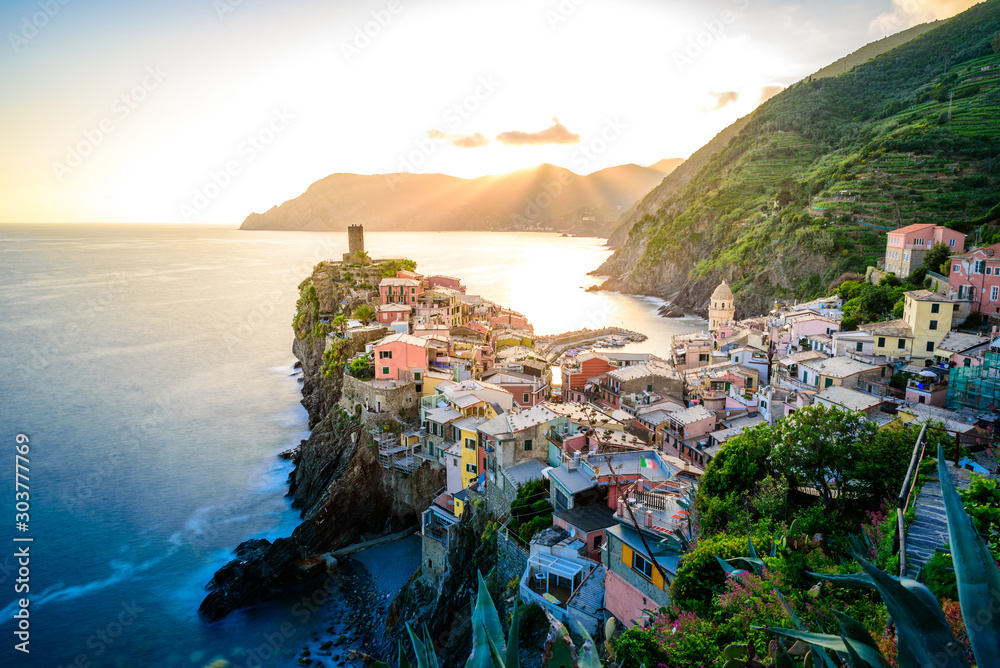 Vernazza - Village of Cinque Terre National Park at Coast of Italy. Beautiful colors at sunset. Province of La Spezia, Liguria, in the north of Italy - Travel destination and attraction in Europe. - obrazy, fototapety, plakaty 
