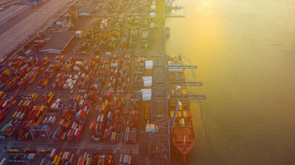 Wall Mural - Container ships loading and unloading in Hutchison Ports, Business logistic import-export transport sea freight and transportation of containers in port, Shipping container buildings, Aerial top view 