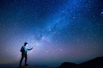 Landscape with Milky way, Milky way background, Night sky with stars and galaxy over night sky and silhouette of a standing people in Thailand