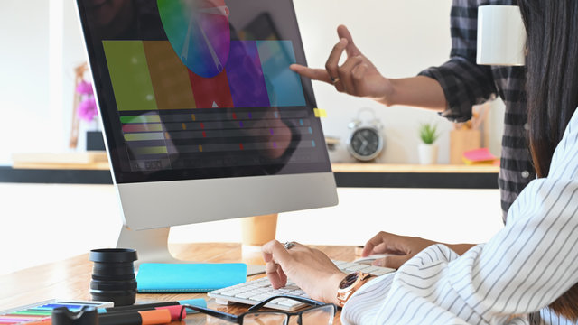 Designer graphic creative creativity work with colour wheel w in computer monitor, Discussion and planning concept.