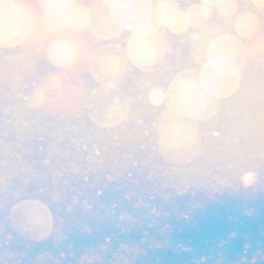 Wall Mural - winter sunny snow texture background with warm lens flare bokeh lights