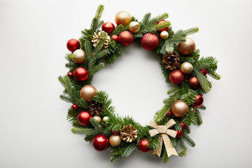 Canvas Print - Top view of festive Christmas wreath with baubles on white background