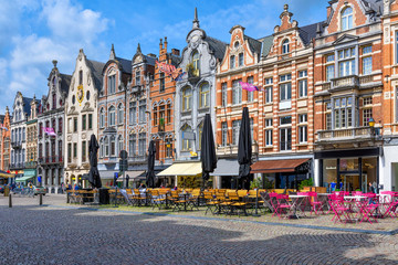 Fototapete - Old street with tables of cafe in Mechelen, Belgium. Mechelen is a city and municipality in the province of Antwerp, Flanders, Belgium.