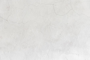 Wall Mural - Rough white relief stucco with cracks wall texture background. blank for designers