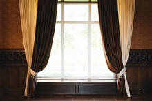 Beige And Brown Curtains Hang On The Window, Copy Space