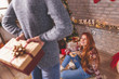 © Impact Photography - Boyfriend giving a Christmas present to a girlfriend