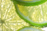 Lemon Slices In Water With Bubbles