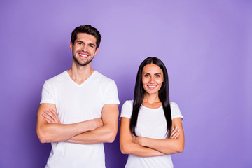 Portrait of his he her she nice attractive lovely charming cute content cheerful cheery couple folded arms isolated over purple violet lilac color pastel background