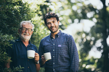 Happy Father and son with coffee cup