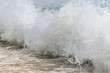 Closeup waves on the beach splashing 