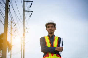 Wall Mural - Engineer holding paper plan work electrician power