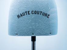Haute Couture Signage On Mannequin Made From Fine Luxury Garment Textile In Luxury Fashion Store Atelier