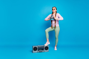 Canvas Print - Full size photo of sweet girlish youngster with braids relax weekends hold disco ball enjoy event put pink sneakers on boombox wear pullover green trousers isolated shine bright color background