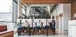 © Flamingo Images - Diverse businesspeople working in the reception area of an offic