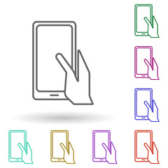 Fototapete - Hand holds a tablet multi color icon. Simple thin line, outline vector of media, press icons for ui and ux, website or mobile application