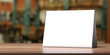 © Rawf8 - Table tent, reserved card sign empty blank on a wooden table, 3d illustration