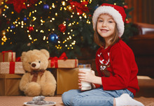Adorable Little Girl Playing With Teddy Bear By Christmas Tree