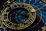 Fototapeta Kosmos - The dominant of Prague astronomical clock on old town times square. Gold wheels shows period, moon phase and next signs.