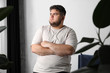 © New Africa - Overweight man suffering from depression at home