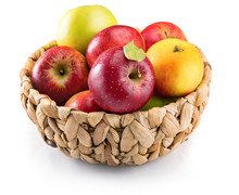 Red Apples In Wicker Basket. Fruity Still Life. Isolated On White Background.