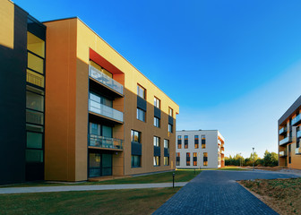 Residential Apartment homes facade architecture and outdoor facilities. Blue sky on the background.