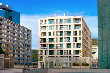 Modern residential apartment with flat building exterior in Vienna of Austria. New luxury house and home complex. City Real estate property and condo architecture. Facade of condominium block.