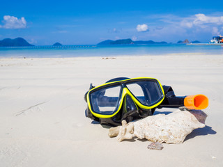 Snorkel on white sand beach with blue sky background, Enjoy snorkeling Tour on your holidays