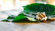 capsule on kratom leaf (Mitragyna speciosa) Mitragynine on wooden ,Drugs and Narcotics,Thai herbal which encourage health