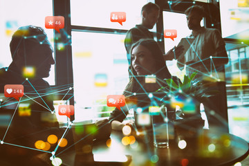 Wall Mural - Concept with business people silhouette talking in the office near a window glass. Network effects