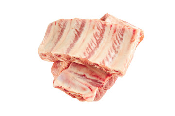 fresh raw pork ribs isolated on a white background. two pieces. ingredient for meat cuisine.