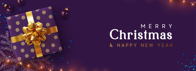 Holiday background Merry Christmas, Happy New Year. Xmas design with realistic festive objects, sparkling lights garland, purple gift box, lilac ball bauble, glitter violet confetti. Horizontal banner