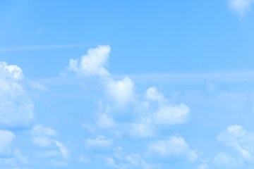 Blue sky with clouds background.