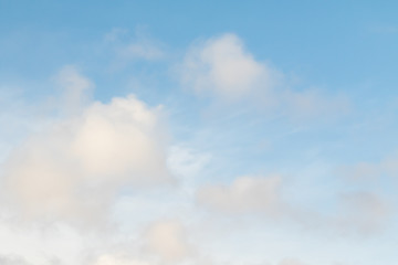 White fluffy clouds on a blue sky.