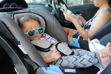 mother and son drive road trip family travel in summer vacation day, cute baby boy sitting on car seat